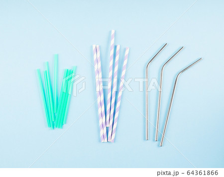Different material drinking straws on pastel blue Different material drinking straws on pastel blue 64361866