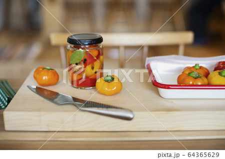 High angle close up of fresh vegetables and knife on wooden cutting board. 64365629
