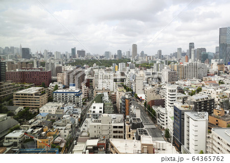 View of the Fukuoka cityscape from a rooftop terrace. 64365762