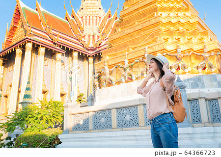 Beautiful asian tourist woman enjoy travel on Vacation in Bangkok at Thailand Beautiful asian tourist woman enjoy travel on Vacation in Bangkok at Thailand 64366723