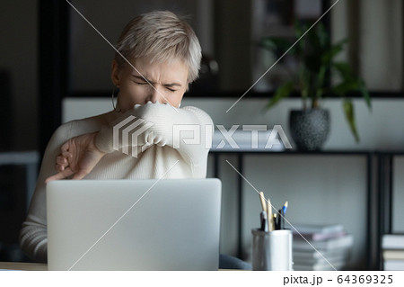 Sick female get infected with coronavirus at workplace Sick female get infected with coronavirus at workplace 64369325