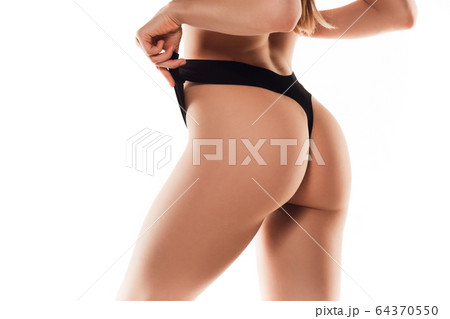 Beautiful female back and butt isolated on white background. Beauty, cosmetics, spa, depilation, treatment and fitness concept, sensual posing 64370550