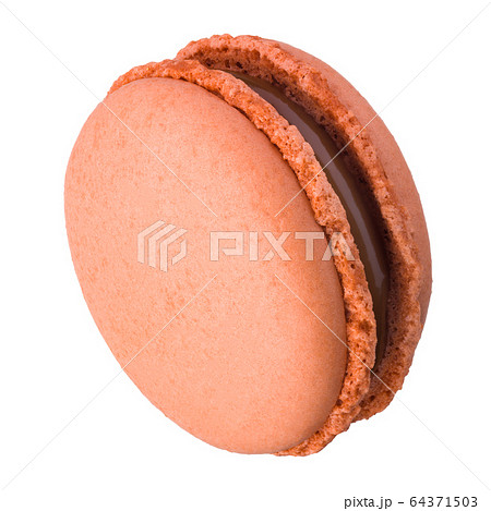 Macro photo of french caramel macaroon or macaron isolated on white background 64371503