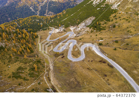 Drone aerial view - windy road in autumn 64372370