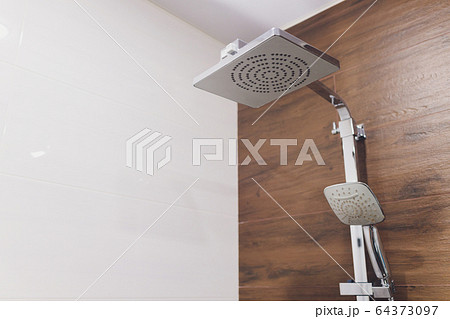 Interior of bathroom with modern shower head in bathroom. Interior of bathroom with modern shower head in bathroom. 64373097