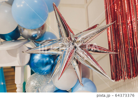 Colorful balloons in room prepared for birthday party. 64373376