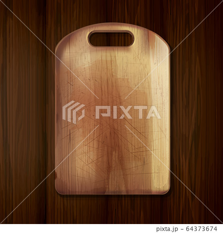Wooden cutting board on a wooden table. Wooden cutting board on a wooden table. 64373674