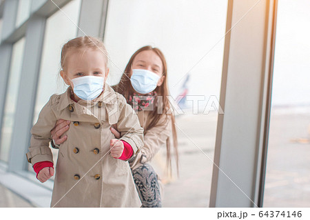 Family of mom and kid at airport waiting for boarding 64374146