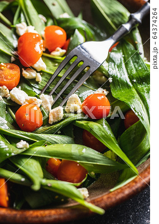 Fresh salad with wild garlic,tomatoes and feta Fresh salad with wild garlic,tomatoes and feta 64374264