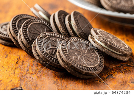 Dark cream sandwich cookies. Dark cream sandwich cookies. 64374284