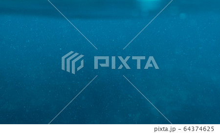 Surface blue underwater with plankton in tropical Surface blue underwater with plankton in tropical 64374625