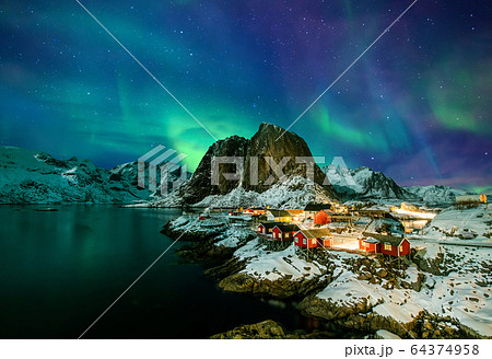 Aurora borealis over Hamnoy in Norway 64374958