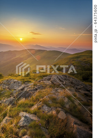 Beautiful summer sunset in the mountains 64375600