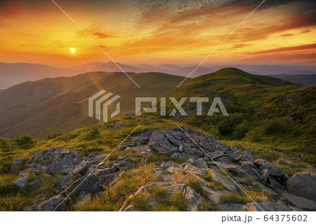 Beautiful summer sunset in the mountains 64375602