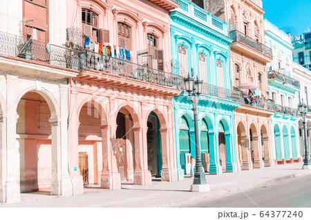 Authentic view of a street of Old Havana with old buildings and cars Authentic view of a street of Old Havana with old buildings and cars 64377240