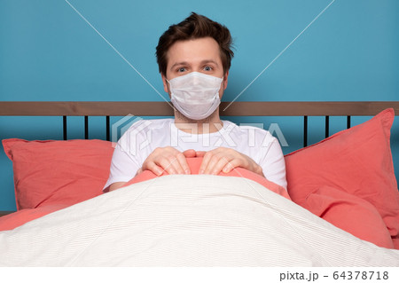 Sick mature caucasian man lying down in bed Sick mature caucasian man lying down in bed 64378718