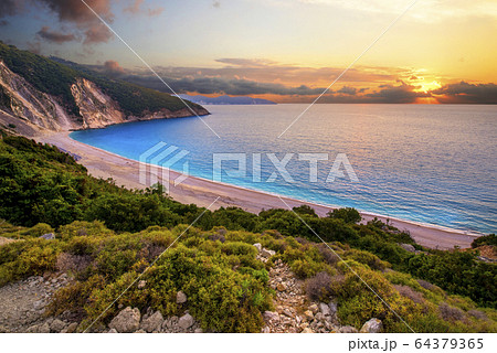 Beautiful summer sunset on Mirtos beach in Greece 64379365