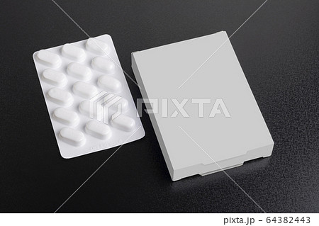 Pillbox mock-up with loaf of tablets on dark Pillbox mock-up with loaf of tablets on dark 64382443