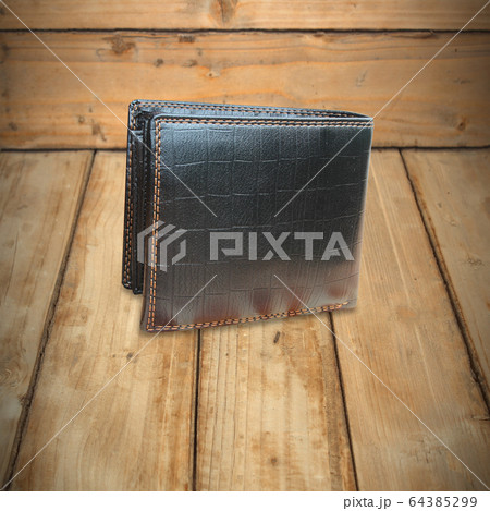 Black Leather Wallet on wooden background texture Black Leather Wallet on wooden background texture 64385299