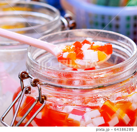 Put ice sweet, jelly, sugar, milk, black jelly. on white background.sweet desert for child. 64386289