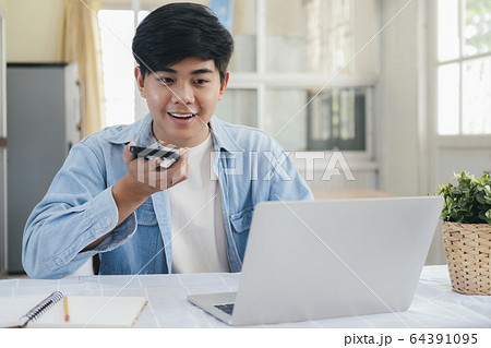 Young man talking with handfree on the phone. 64391095
