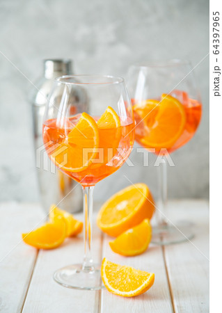 Aperol and ingredients drinks on wood background 64397965