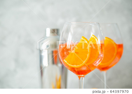 Aperol and ingredients drinks on wood background 64397970
