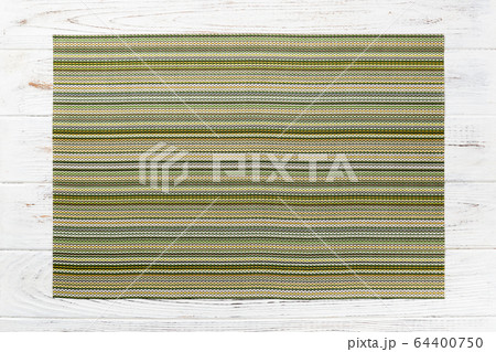 Top view of green place mat for a dish. Wooden 64400750