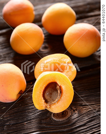 apricots on wooden backgrund 64401070