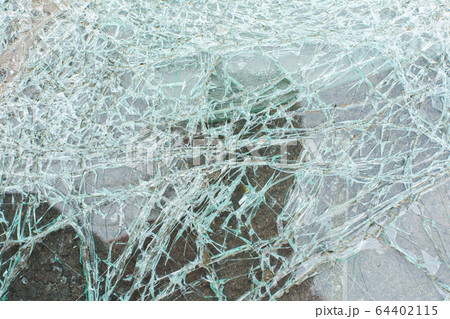 Broken car glass after an accident close up Broken car glass after an accident close up 64402115