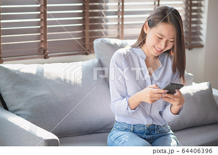 Beautiful woman using mobile phone and internet technology to use online chat with her friends Beautiful woman using mobile phone and internet technology to use online chat with her friends 64406396