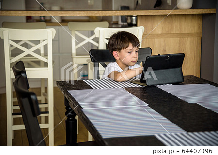 Toddler staring at tablet. Education, gadget, Toddler staring at tablet. Education, gadget, 64407096