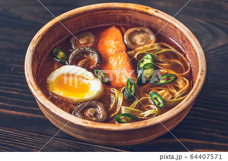 Bowl of ramen with salmon 64407571