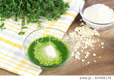 Homemade herb facial mask from  finely ground oat 64408178