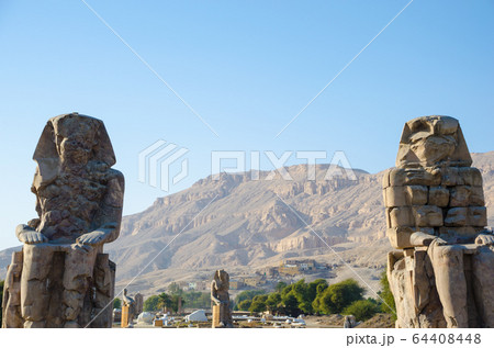 Luxor, Egypt. The Colossi of Memnon are two 64408448