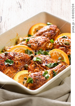 Fried chicken with oranges 64409204