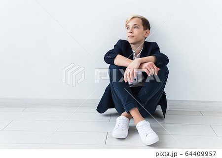 Teenage depression and puberty concept - Sad teenager portrait close up on white background. 64409957