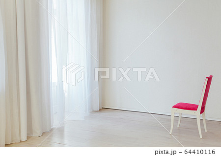one red chair in the interior of an empty white office one red chair in the interior of an empty white office 64410116
