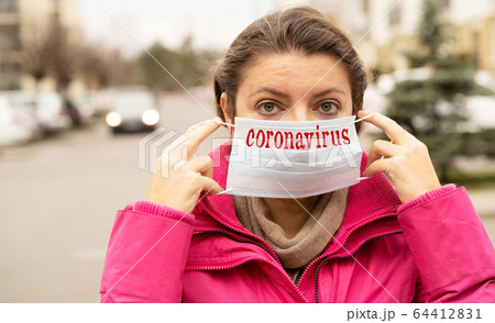 woman wearing virus protection mask 64412831