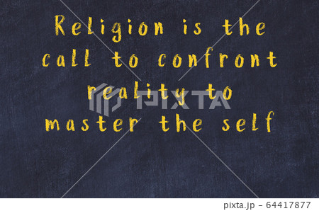 Chalk inscription of smart quote on black desk 64417877