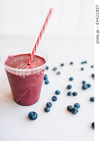 Row of healthy fresh fruit and vegetable smoothies with assorted ingredients 64422897