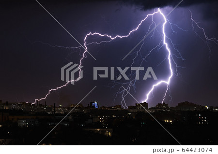 Lightning storm over night city Lightning storm over night city 64423074