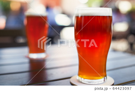 Pint glass of craft beer on table Pint glass of craft beer on table 64423097