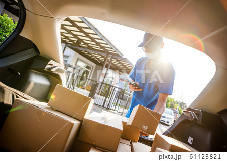 Asian delivery man wearing mask protect covid-19 Asian delivery man wearing mask protect covid-19 64423821