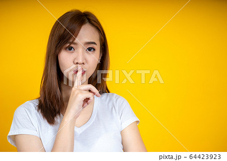 Young Asain woman requires silence. Young 64423923