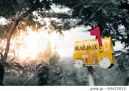 Closeup yellow old mailbox on a natural background Closeup yellow old mailbox on a natural background 64425013