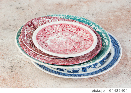 Antique porcelain dishes on concrete background. Antique porcelain dishes on concrete background. 64425404