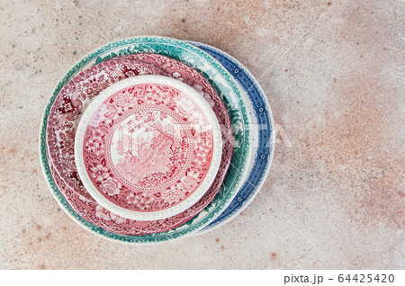 Antique porcelain dishes on concrete background. Antique porcelain dishes on concrete background. 64425420
