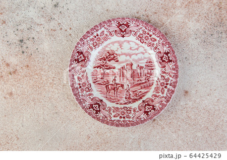 Antique porcelain dish on concrete background. Antique porcelain dish on concrete background. 64425429