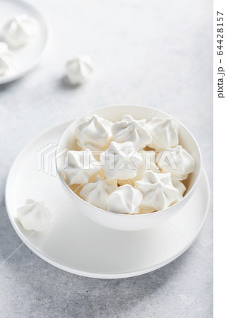Sweet white meringue 64428157